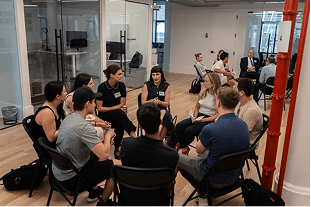 Recruiters practicing candidate conversations in a group coaching session